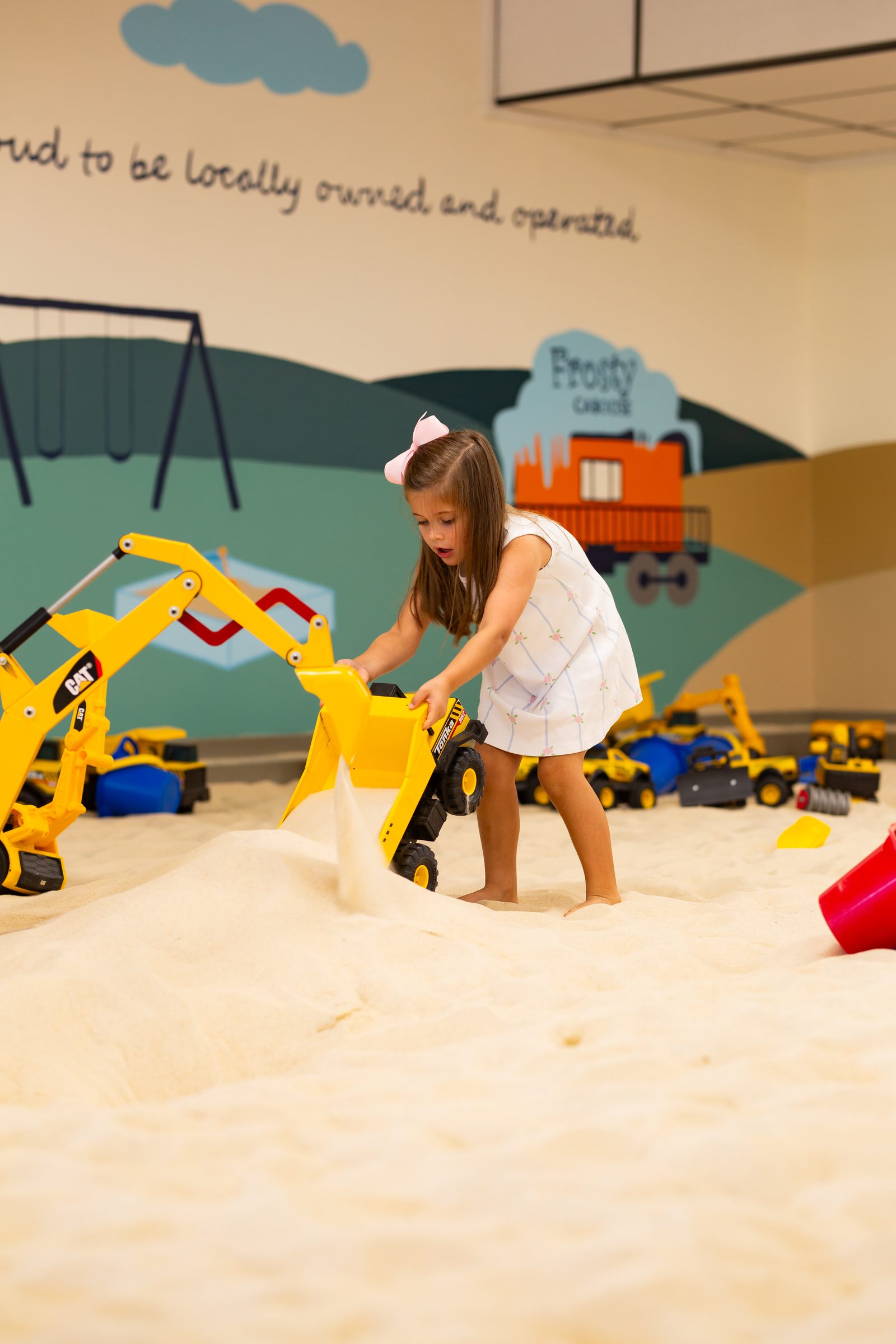 Boy playing with a Tonka dump truck
